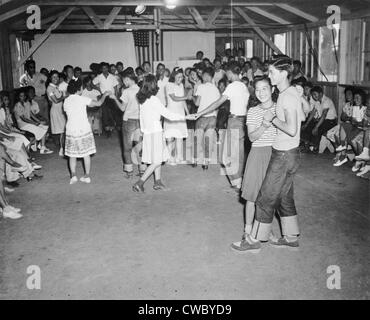 Young Japanese-Americans dancing at the Fresno, California, Assembly Center in 1942. Assembly centers were the initial Stock Photo