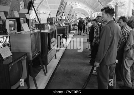 Russians looking at television sets at the American National Exhibition at Sokolniki Park in Moscow on August 5, 1959. A few