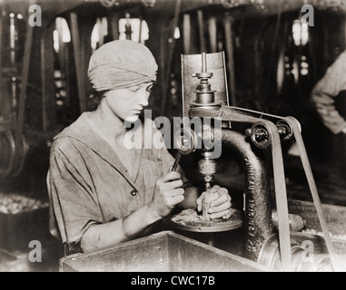 Woman countersinking a detonator tube hole in hand grenade at Westinghouse Electric & Manufacturing. Company, during World War Stock Photo