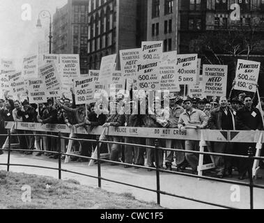 Teamster Union members holding picket signs supporting higher pay and pensions in New York City, 1954. Stock Photo