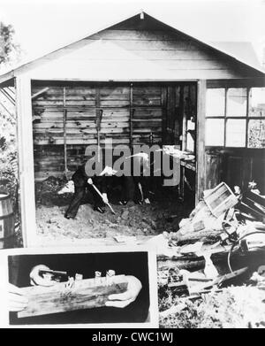 Police digging up the garage floor of accused Lindbergh baby kidnapper Bruno Richard Hauptmann searching for ransom money. Stock Photo