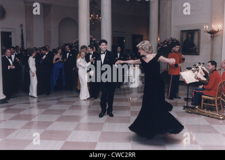 Princess Diana dancing with John Travolta after a White House dinner for the Prince and Princess of Wales. Nov. 9 1985. Stock Photo