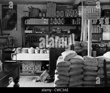 General store interior in Moundville Alabama. Goods for sale include flour salt cooking utensils canning jars soap kerosene Stock Photo