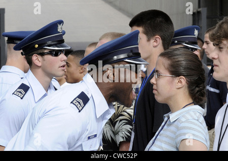 A Cadet 2nd Class yells instructions at new basic cadets during cadet in-processing at the US Air Force Academy in Colorado Stock Photo