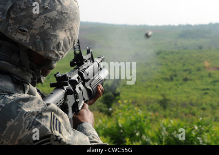 US soldier fires a practice round out of a M203 grenade launcher at Marine Corps Base Quantico Virginia. July 15 2010. Stock Photo
