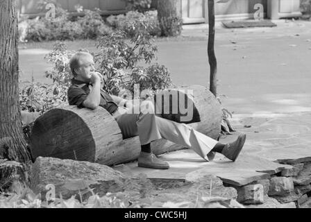 President Jimmy Carter sitting in a rustic log hewn chair at the Camp David Presidential retreat. Ca. 1977-1980. Stock Photo