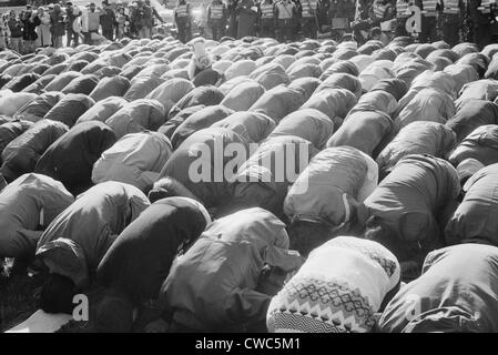 Iranian men kneeling in prayer at an demonstration during the Iran Hostage Crisis in Washington D.C. Nov. 30 1979 Stock Photo