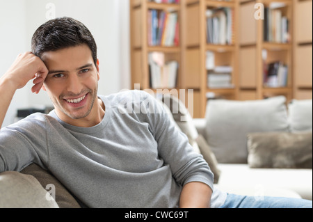 Man resting on a couch Stock Photo