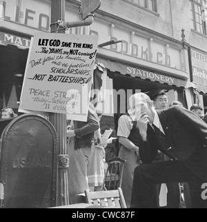 1940 Peace Strike at Berkeley. University of California student listens to the speaker at the Peace Strike next to a poster Stock Photo