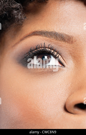 Cropped image of African American woman with eye makeup Stock Photo