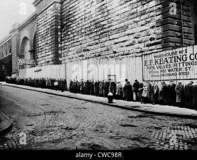 Bread line beside the Brooklyn Bridge approach. New York City ca. 1930-35. Stock Photo