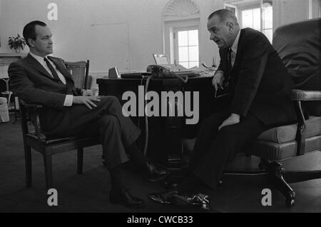 President Lyndon Johnson meets with Richard Helms. Johnson appointed Helms CIA Director in 1966.Oval Office, White House, April Stock Photo