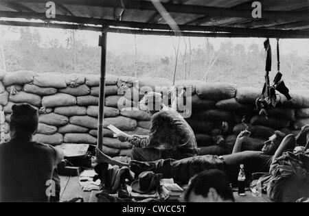 Vietnam War. Soldiers relaxing at a US Special Forces camp at Phey-Shuron, in the central Vietnam highlands. They are among 12 Stock Photo