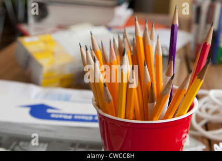 Red plastic cup full of sharpened #2 wood lead  pencils Stock Photo