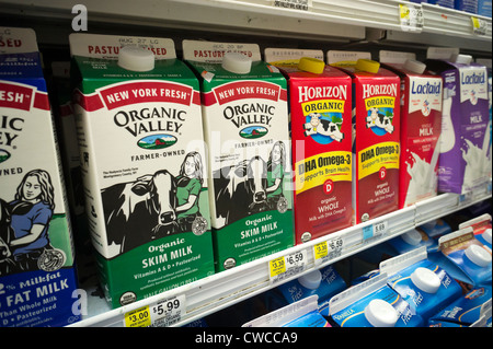 Containers of milk in a supermarket refrigerator in New York Stock Photo -  Alamy