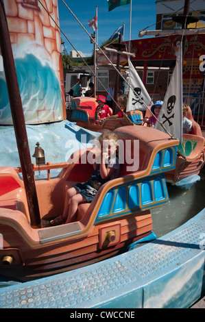 Little Girl Child On A Fairground Ride UK Stock Photo