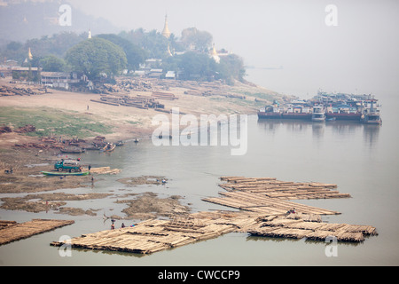 Log rafts, transporting wood on the Irrawaddy River in Myanmar Stock Photo