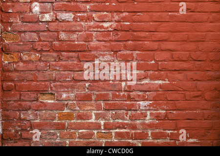 Stone texture - Rustic and worn bricks painted with a red color. Stock Photo