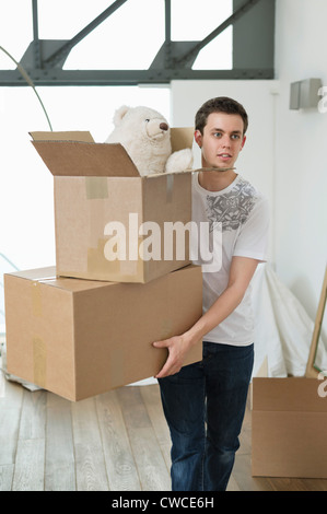 Man carrying cardboard boxes Stock Photo