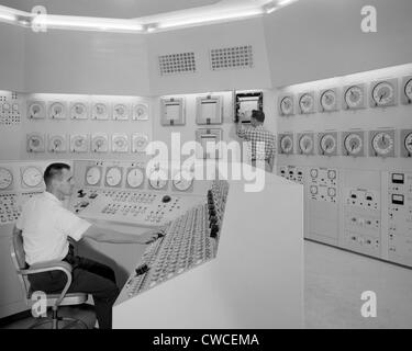 Technicians in a nuclear reactor control room at NASA's Plum Brook Station in Sandusky, Ohio. 1959. Stock Photo