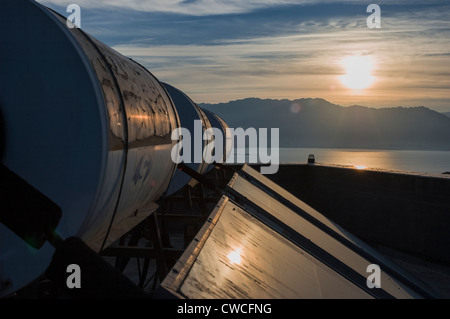 Solar water heater collector and tanks on the roof of a guesthouse in ...
