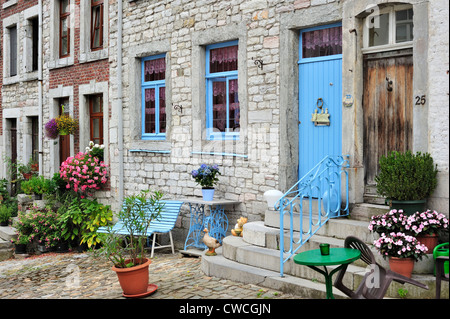 Houses with flowers along the place Saint-Georges / Saint George Square in the town Limbourg in the Belgian Ardennes, Belgium Stock Photo