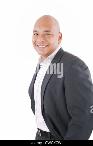 Happy businessman standing with hands in pocket, looking at camera, smiling. Isolated on white background Stock Photo