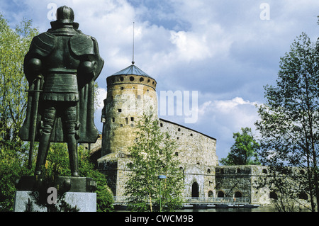 Medieval knight in armor outside Olavinlinna (St. Olaf’s Castle), a 15th century stone fortress in Savonlinna, Finland Stock Photo