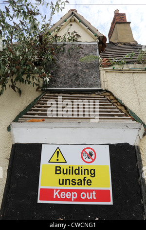 Unsafe building warning sign Stock Photo