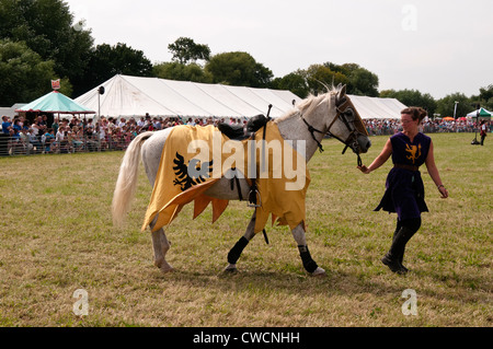 Jousting horse being taken back to its knight at the Chertsey Show 2012 Surrey England Stock Photo