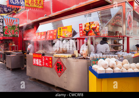 Food stalls in a side street off Wangfujing Street in central Beijing, China. Stock Photo