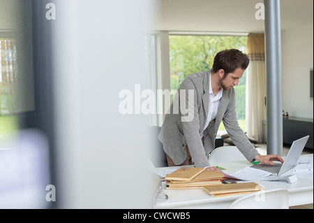 Interior designer working on a laptop in the office Stock Photo
