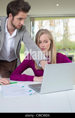 Couple working in home office Stock Photo