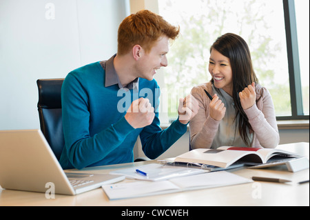 Business people showing fist and smiling Stock Photo