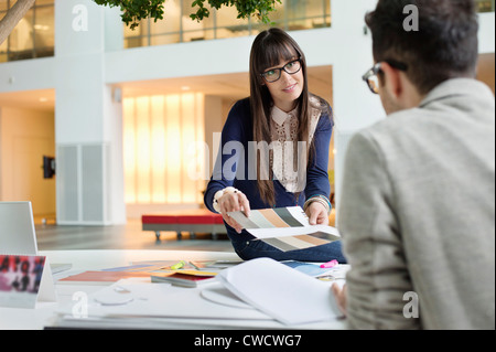 Fashion designers discussing in an office Stock Photo