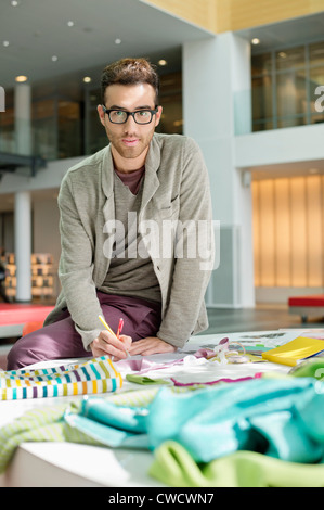 Male fashion designer working in an office Stock Photo