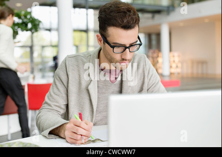 Male fashion designer working in an office Stock Photo