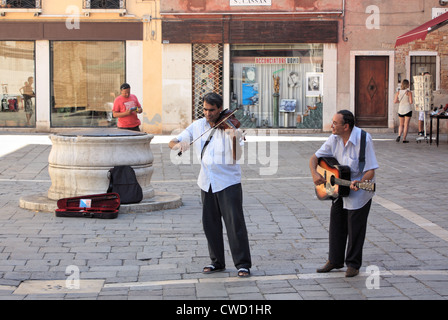 Street musicians at Campo San Cassian, San Polo area, Venice Stock Photo