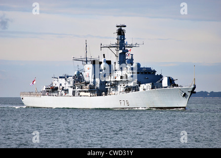 The Royal Navy Frigate HMS Kent enters Portsmouth navy dockyard. Stock Photo