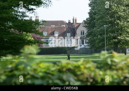 A lone early-morning walker in Salisbury Cathedral Close, Wiltshire England Stock Photo