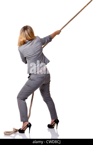 young businesswoman pull rope isolated on white Stock Photo