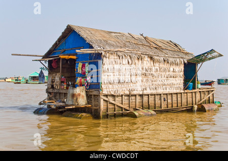 Horizontal wide angle view of a floating house of Kompong Khleang, the floating village on Tonle Sap Lake in Cambodia Stock Photo
