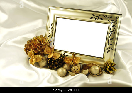 Beautiful golden frame against white silk satin Stock Photo
