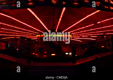Spinning carousel by night Stock Photo