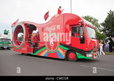 London 2012 Olympic sponsor Coca Cola float in torch relay procession Stock Photo
