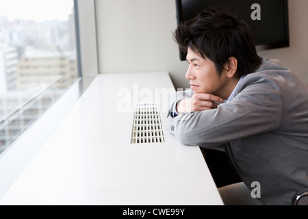 Businessman looking away at office Stock Photo