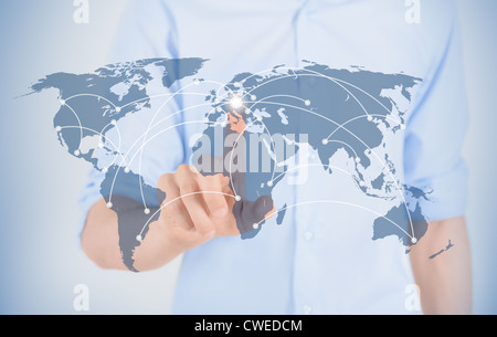 Man touching on world map with futuristic communication interface. Stock Photo