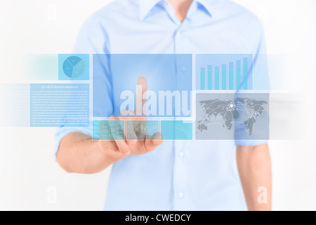 Man touching futuristic touchscreen interface with some graphic, charts and news. Isolated on white. Stock Photo