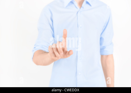 Man touching virtual screen. Isolated on white. Stock Photo