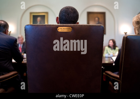 President Barack Obama holds a Cabinet meeting in the Cabinet Room of the White House July 26, 2012 in Washington DC. Sign on the back of his chair marks it as the presidents. Stock Photo
